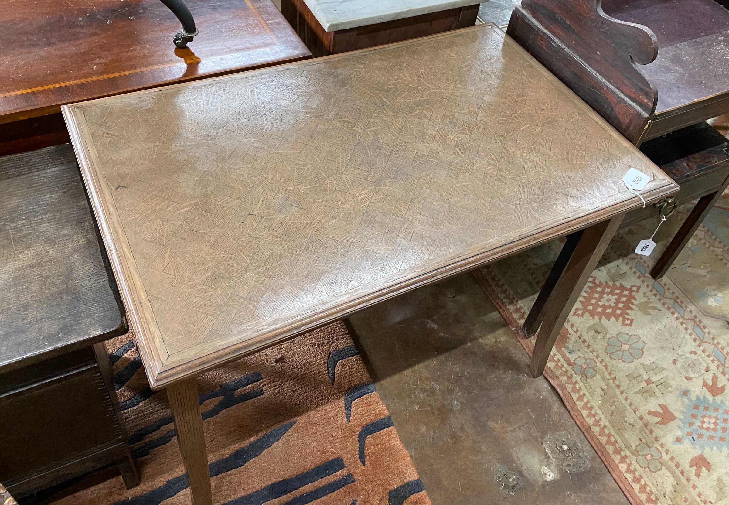 An early 20th century rectangular oak parquetry side table, width 92cm, depth 57cm, height 71cm together with a French caned side chair